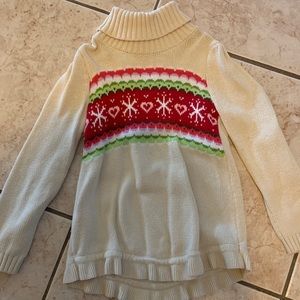 Girls tan turtleneck.